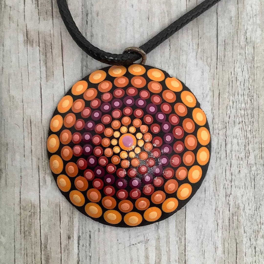 Dot mandala pendant in warm colors by MandalaStone