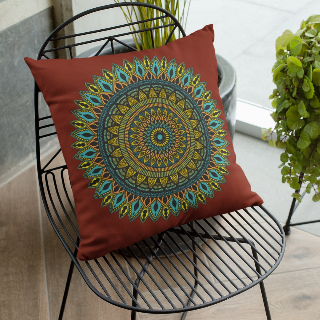 A cozy carmine throw pillow named 'Southwestern Serenity: Carmine Mandala,' exuding warmth and Southwestern charm through its design.