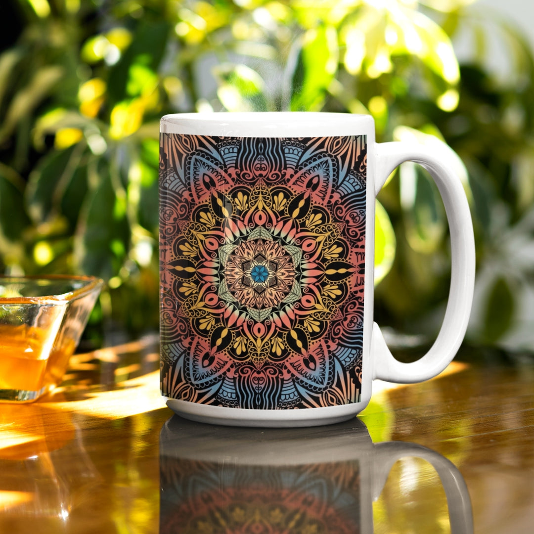 A psychedelic mandala mug in blue, yellow, and red hues, featuring a vibrant and intricate design that offers a captivating visual experience.