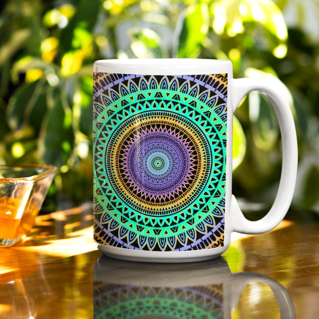 A vibrant mandala mug in mint green, purple, and yellow hues, featuring an intricate design that infuses colorful energy into the visual experience