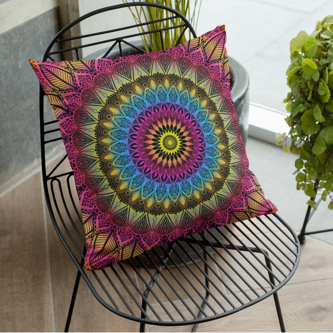 A vibrant and dynamic mandala throw pillow named 'Color Burst: Vibrant Mandala Throw Pillow in Pink, Blue & Yellow,' exuding artistic brilliance and energetic self-expression through its design.