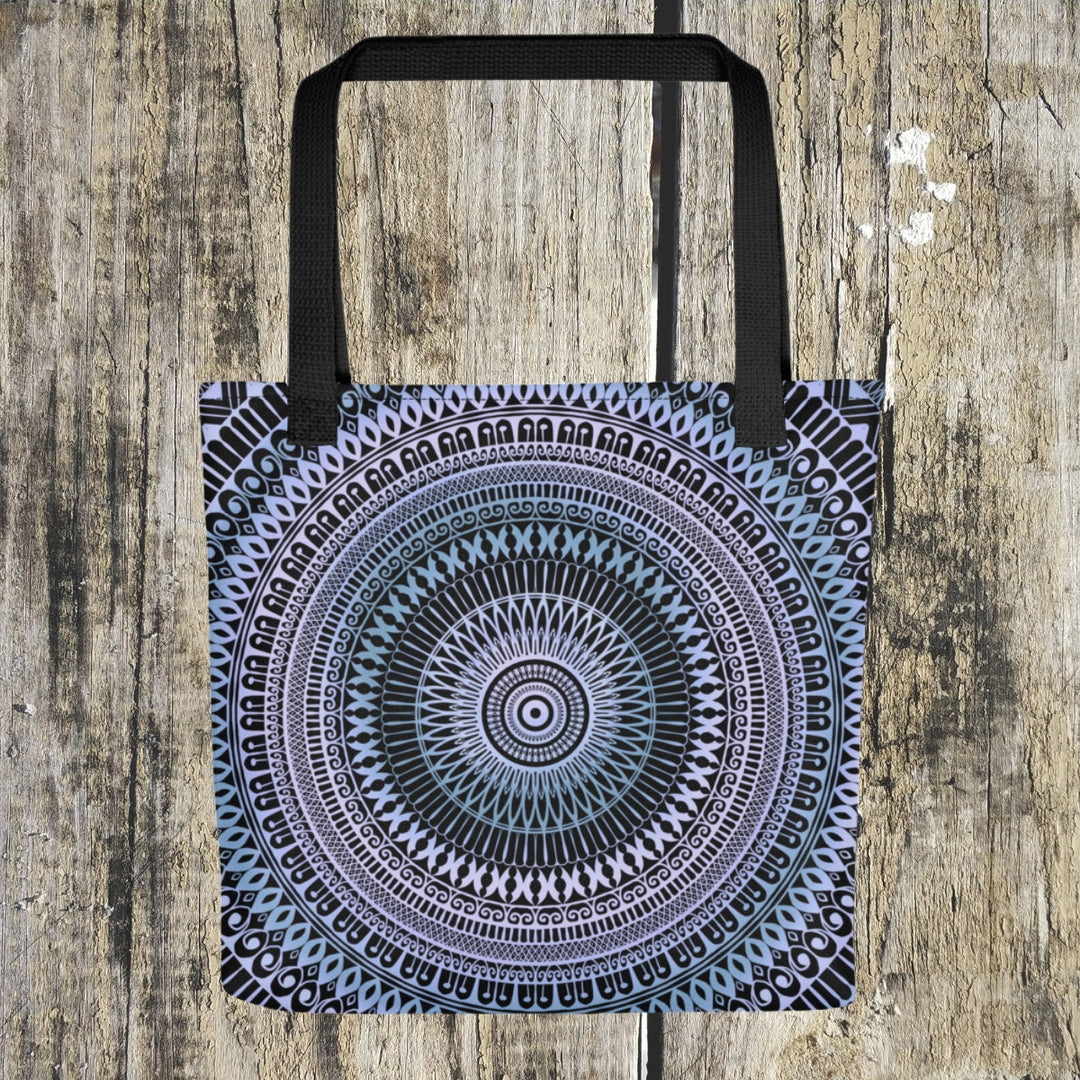 A serene mandala tote bag named 'Icy Whispers' in Subtle Pink and Blue, exuding a sense of calm and tranquility.