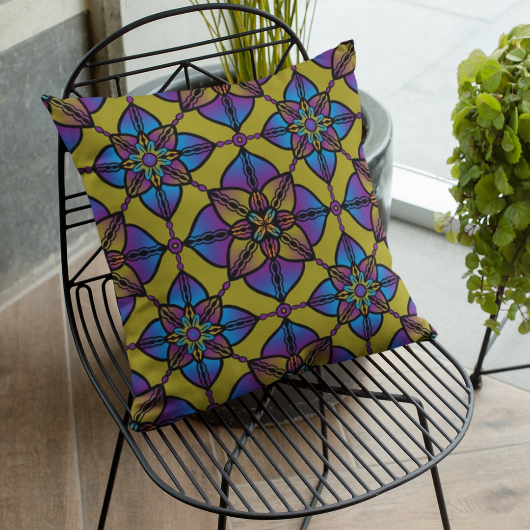 A vibrant and harmonious mandala throw pillow named 'Vibrant Harmony: Kaleidoscope Mandala Throw Pillow in Purple, Blue & Yellow,' exuding artistic brilliance and energetic self-expression through its design.
