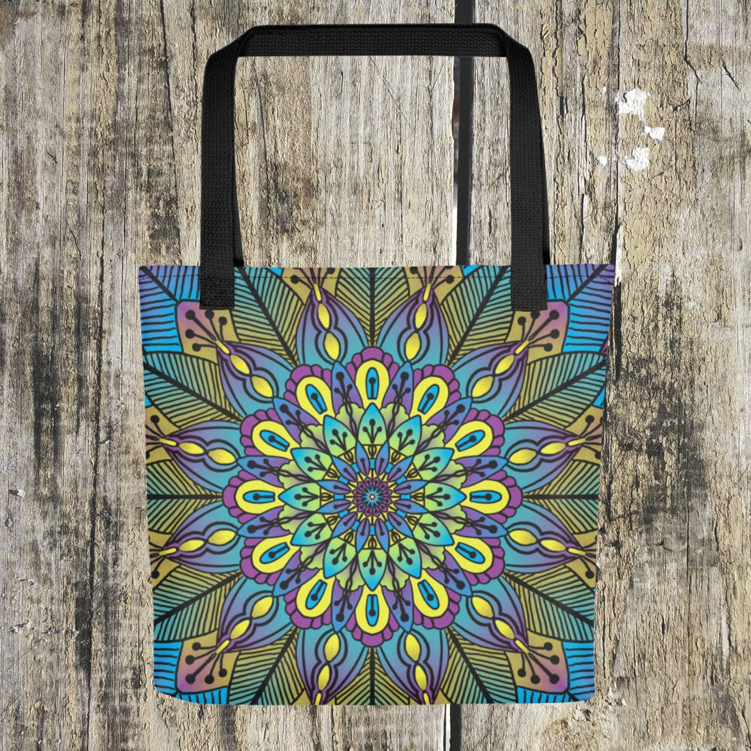 A beautiful mandala tote bag named 'Blossoming Harmony: Flower Mandala' in Green, Yellow, and Purple, exuding the serenity and vibrancy of nature.