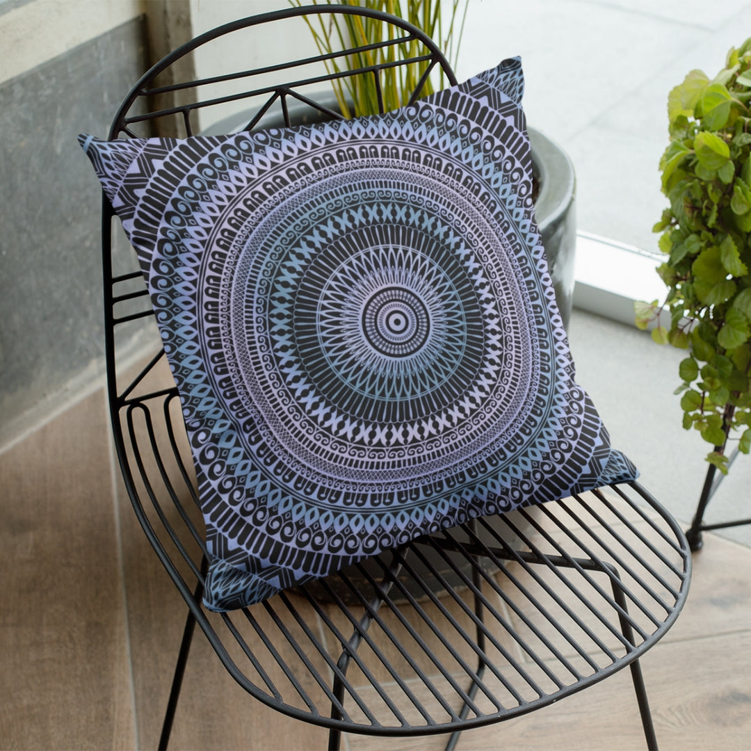 A serene mandala throw pillow named 'Icy Whispers: Mandala Throw Pillow in Subtle Pink and Blue,' exuding tranquility and elegance through its design.