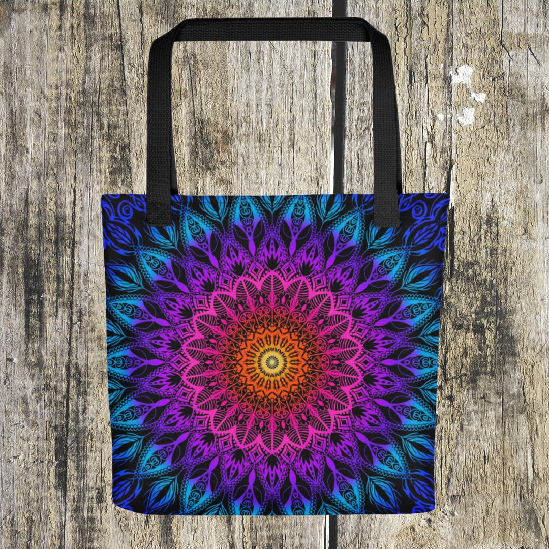  A vibrant mandala tote bag named 'Boho Fiesta' adorned with a lively mix of Orange, Pink, Purple, and Blue, exuding a festive and free-spirited vibe.