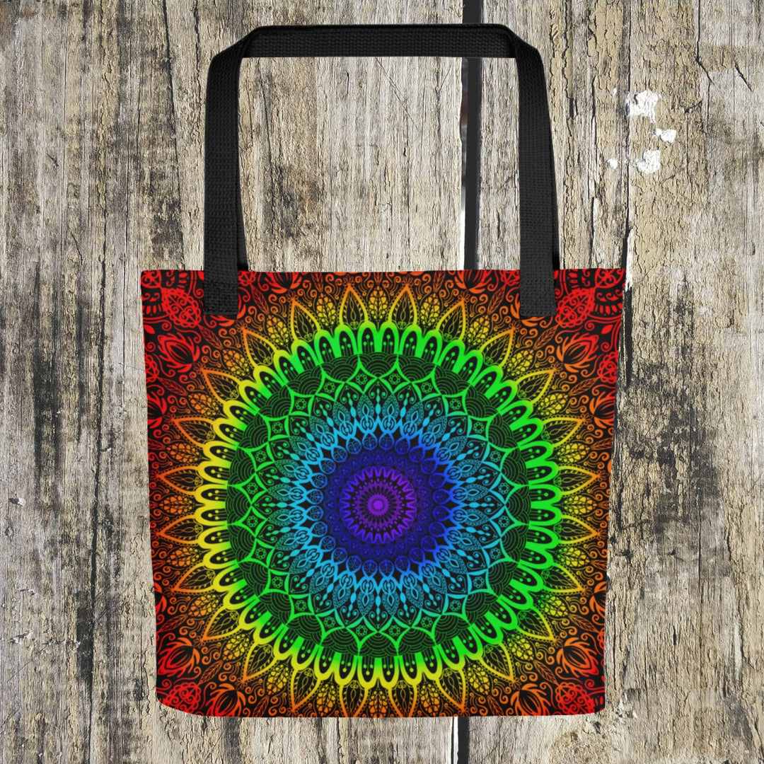 A vibrant mandala tote bag featuring a design in the seven Chakra colors, representing spiritual balance and harmony.