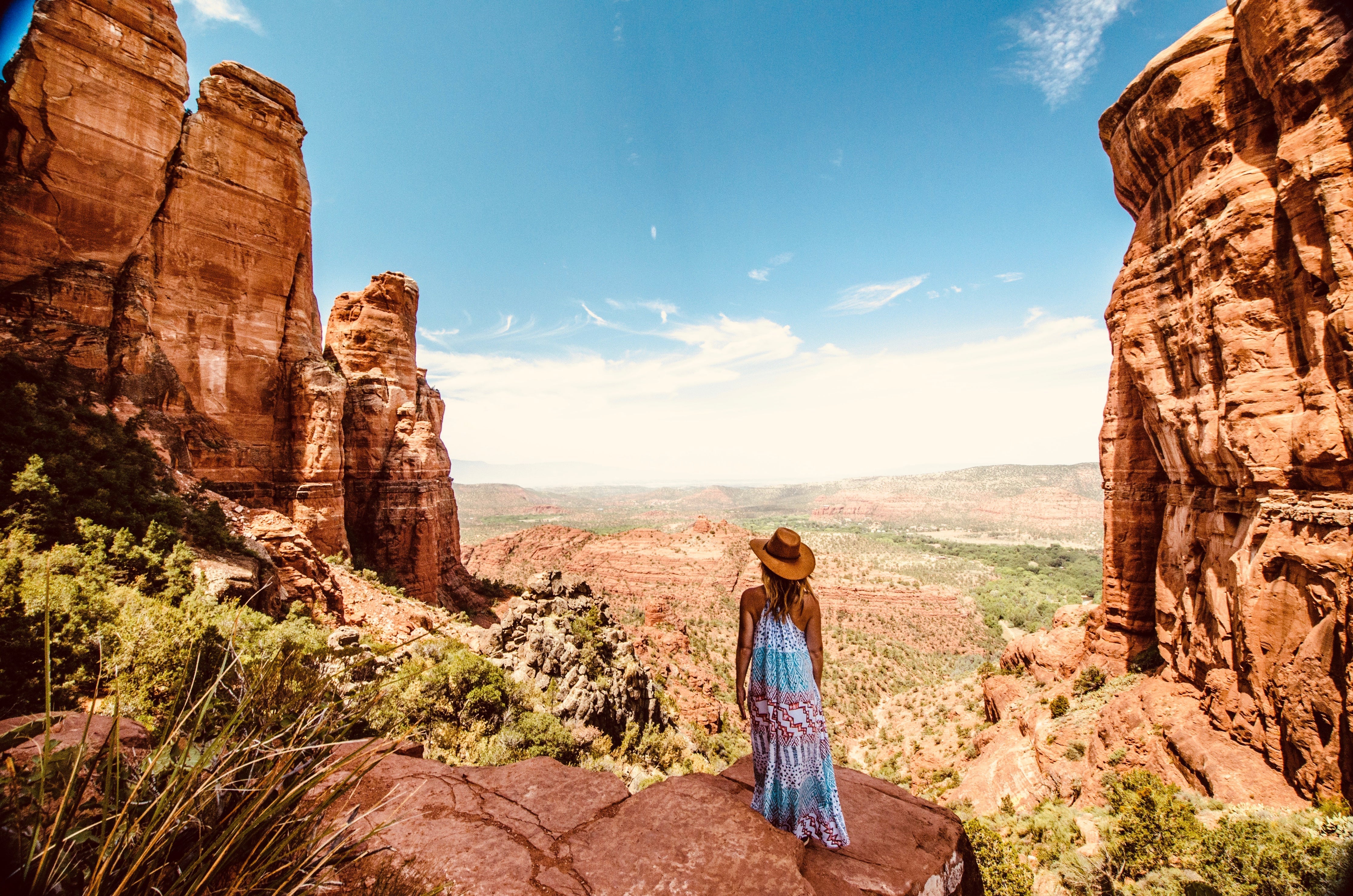 Woman in boho dress looks out over Grand Canyon, header image for webshop Mandala Stone